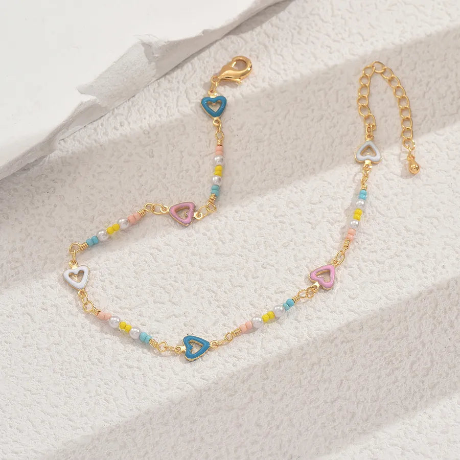 tobillera cobre bañado en oro 18k con ceramics Loyobriyida fondo blanco