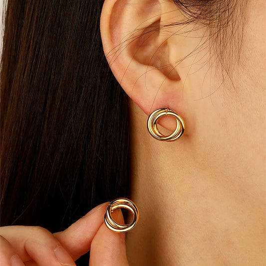 pendientes 304 acero inoxidable imitación oro diseño redondo Loyobriyida fondo blanco
