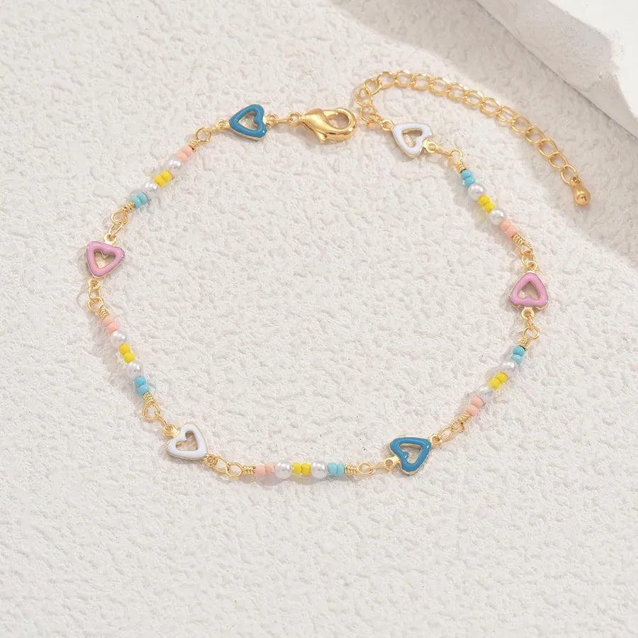tobillera cobre bañado en oro 18k con ceramics Loyobriyida fondo blanco