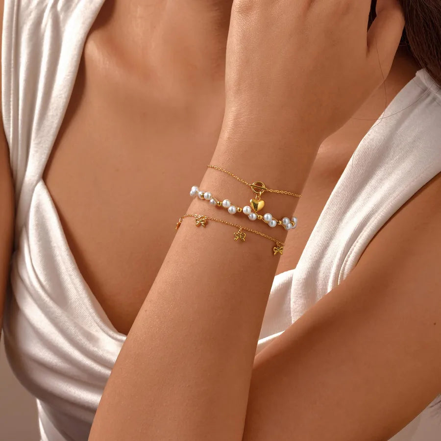 pulsera 201 acero inoxidable bañado en oro 18k diseño lazo Loyobriyida fondo blanco