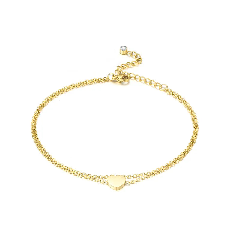 tobillera acero inoxidable bañado en oro diseño forma corazón Loyobriyida fondo blanco