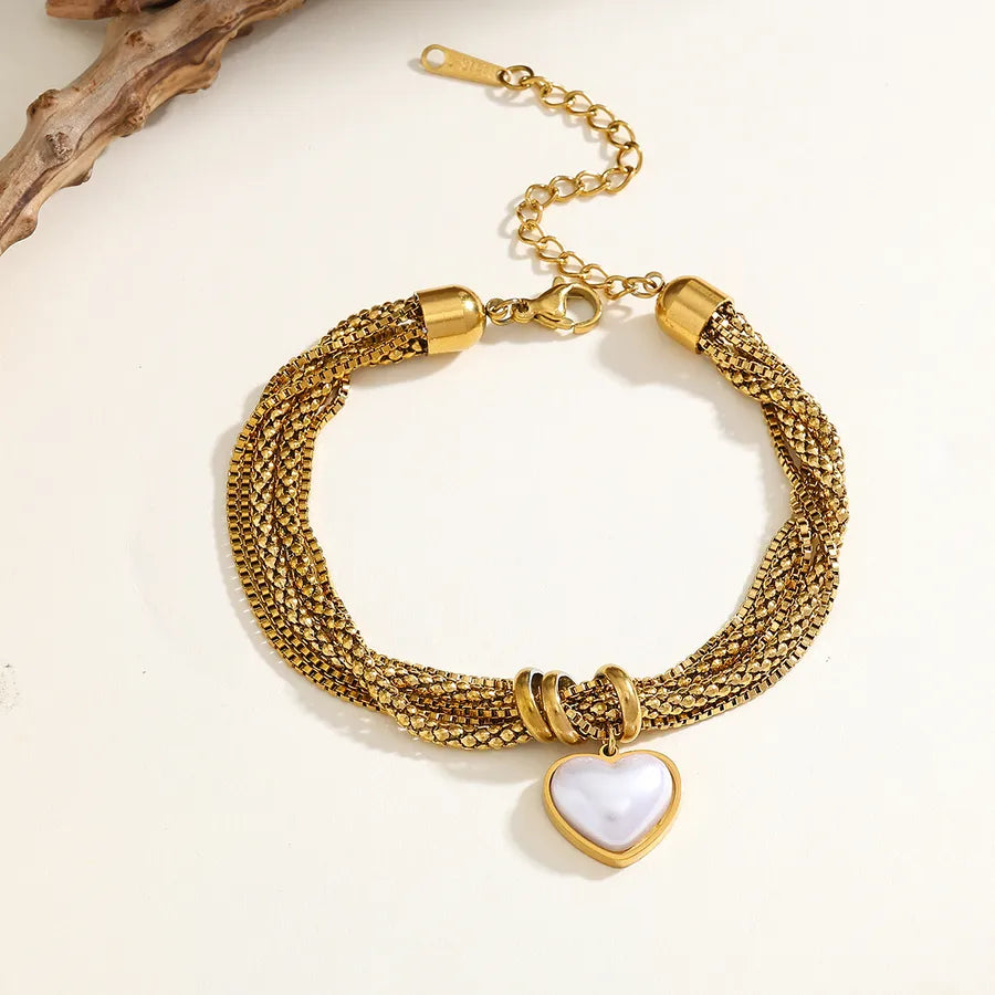 pulsera 304 acero inoxidable bañado en oro 18k con imitación perla Loyobriyida fondo blanco