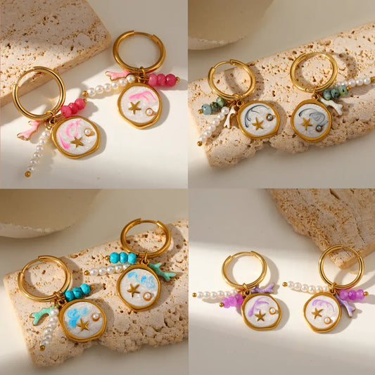 pendientes 304 acero inoxidable bañado en oro 18k con perla de imitación Loyobriyida fondo blanco