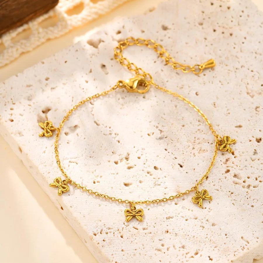 pulsera 201 acero inoxidable bañado en oro 18k diseño lazo Loyobriyida fondo blanco