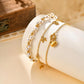 pulsera 201 acero inoxidable bañado en oro 18k diseño lazo Loyobriyida fondo blanco