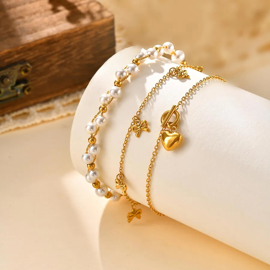 pulsera 201 acero inoxidable bañado en oro 18k diseño lazo Loyobriyida fondo blanco